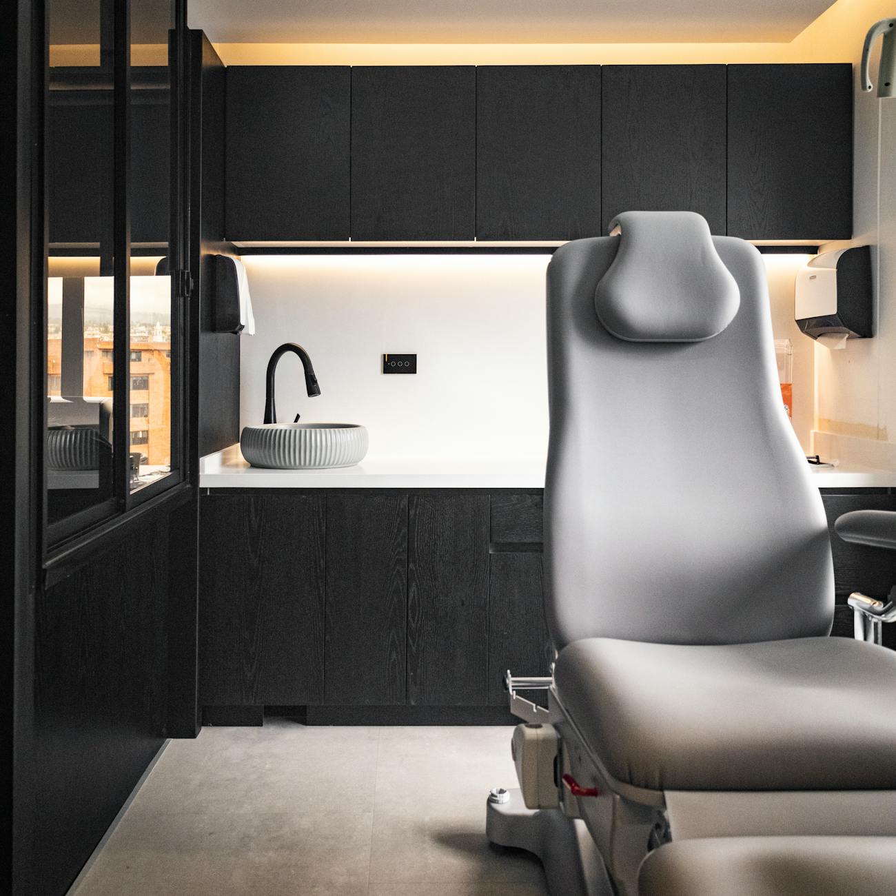 armchair and sink in room